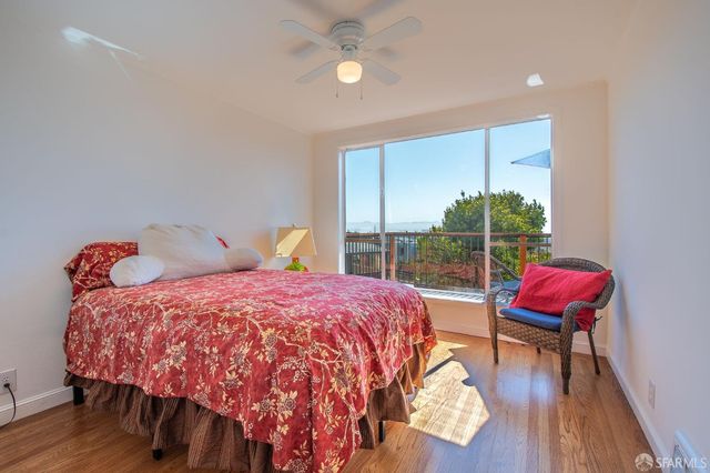 a view of a chairs and table in the balcony