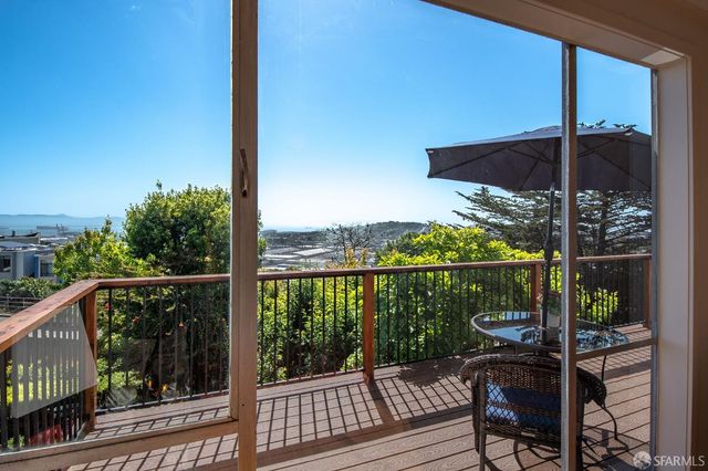 a view of a water fountain and an outdoor seating