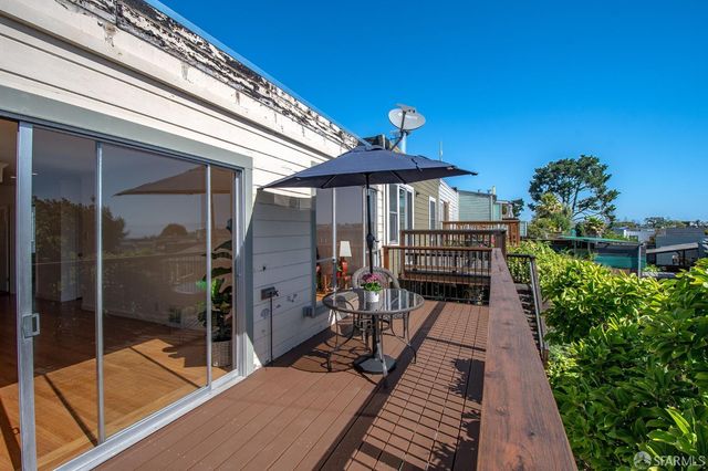 a view of a porch with furniture and yard