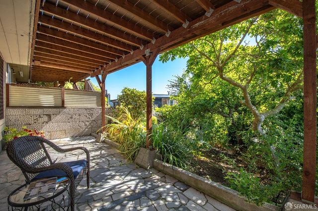 a view of a dry yard with wooden stairs