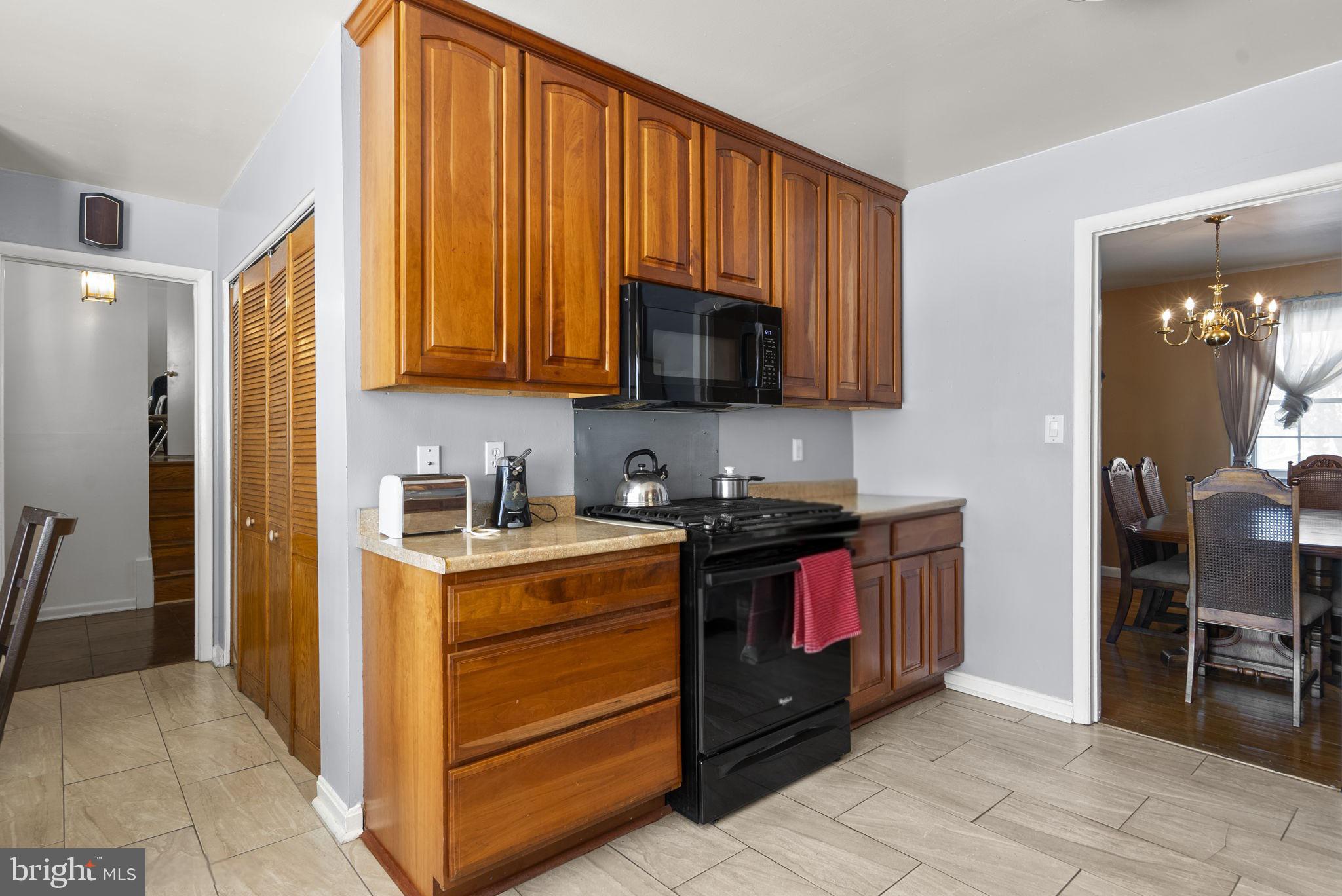 1408 Chilton Drive Silver Spring, MD 20904 - Photo 11 of 29 a kitchen with stainless steel appliances granite countertop a stove a sink and a refrigerator