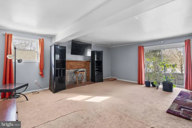 a view of a livingroom with furniture and front door