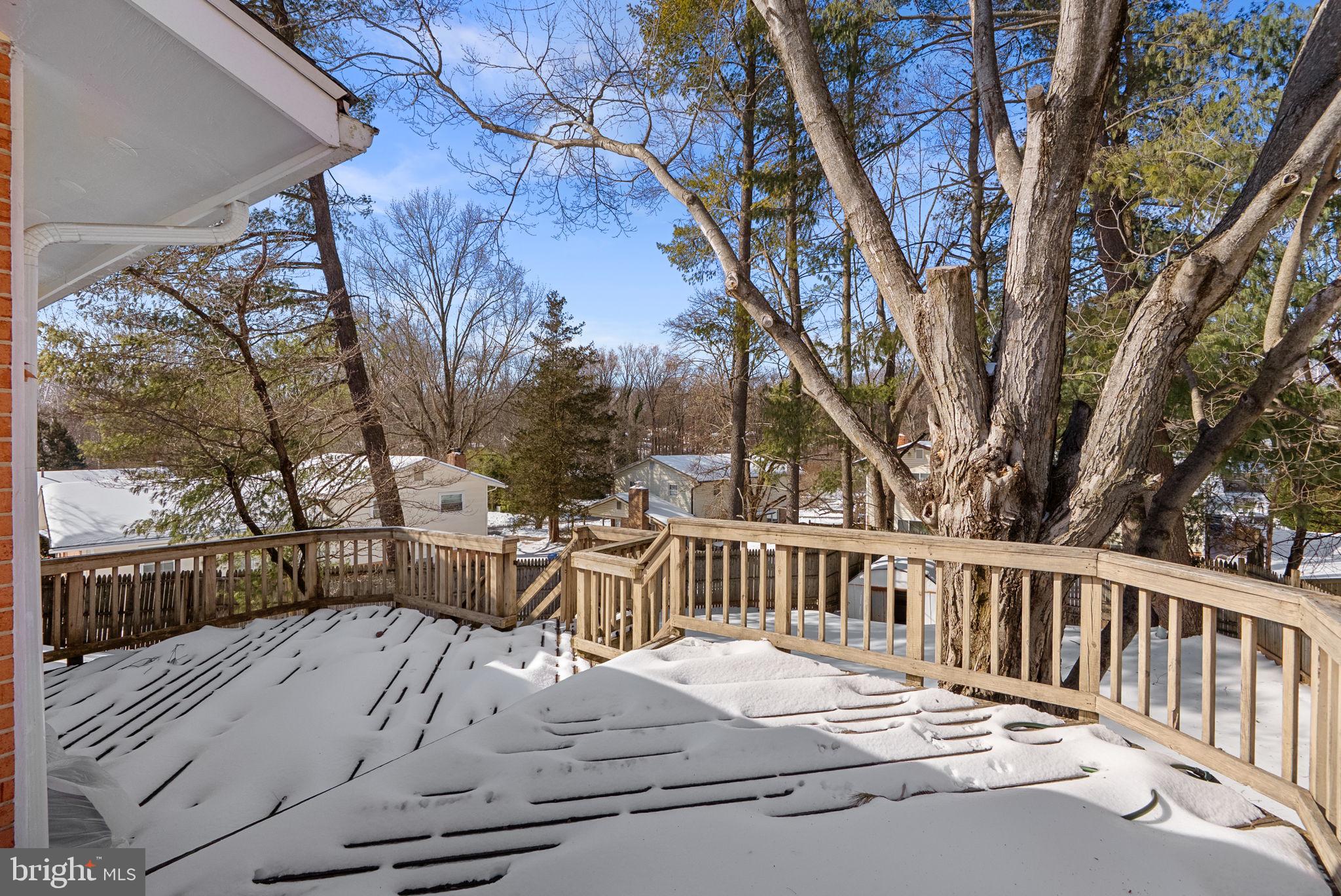 1408 Chilton Drive Silver Spring, MD 20904 - Photo 26 of 29 a view of a wooden deck with chairs and a yard