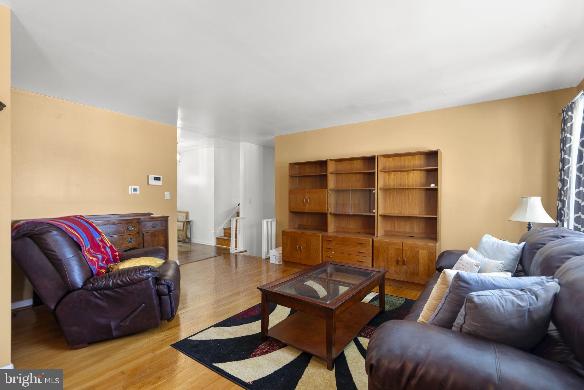 1408 Chilton Drive Silver Spring, MD 20904 - Photo 7 of 29 a living room with furniture a rug and a window