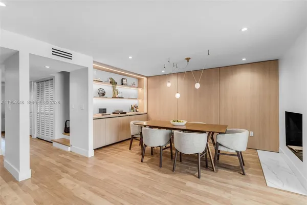 a kitchen with a table and chairs in it