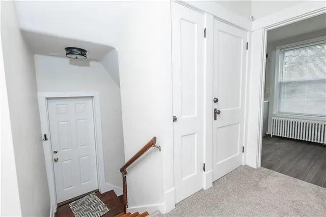 a view of a hallway with closet and entryway