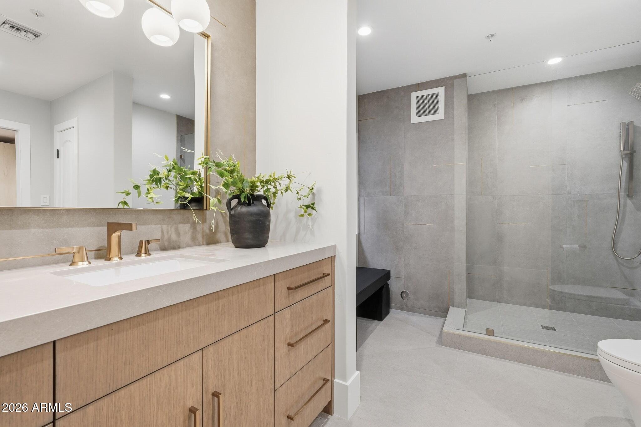 7475 East Gainey Ranch Road, Unit 7 Scottsdale, AZ 85258 - Photo 59 of 77 a bathroom with a sink a toilet and shower