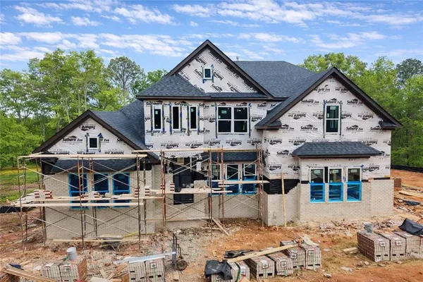 a front view of a house with a yard