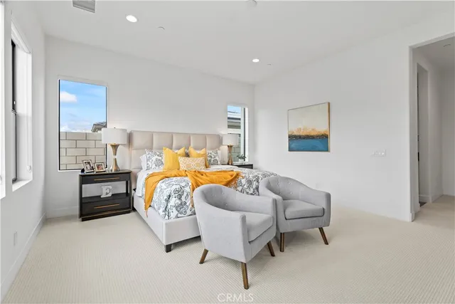 a bedroom with furniture and a window