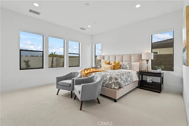 a bed room with furniture and a window