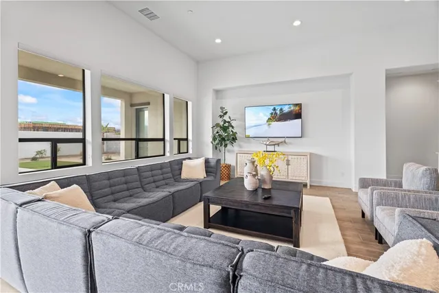 a living room with furniture and a large window