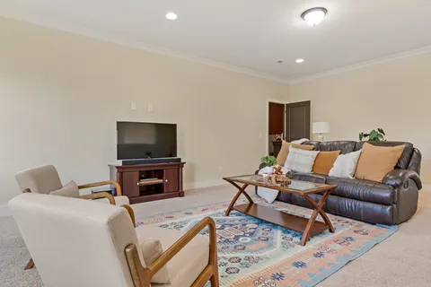 a bedroom with a bed and a couch