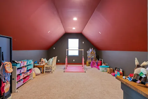 a view of a house with a yard and sitting area