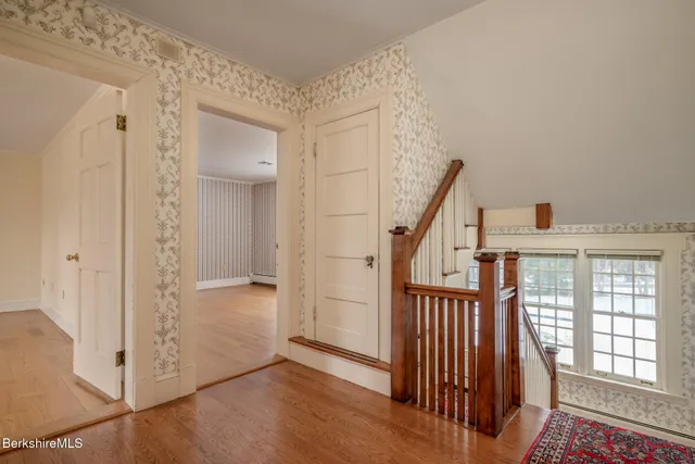 a view of livingroom with furniture wooden floor and windows