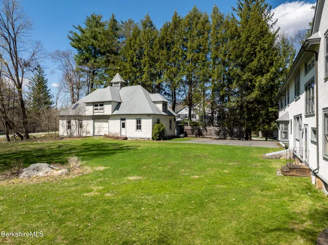 a view of a kitchen with a sink and a refrigerator