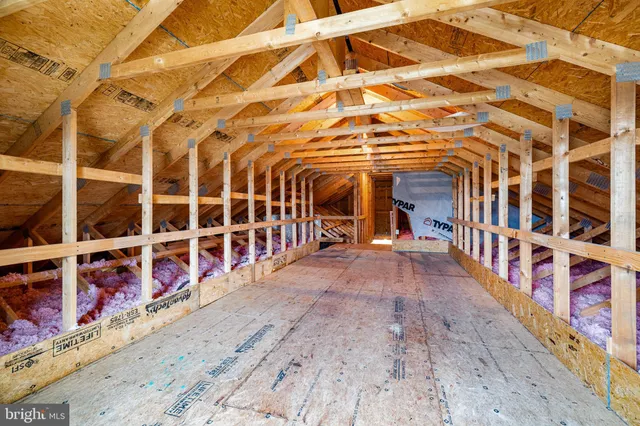 a sign that is in front of flowers