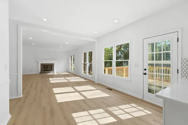 a view of empty room with windows