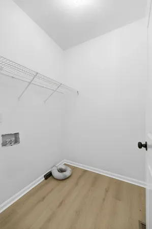 a view of a small space with racks on the wall