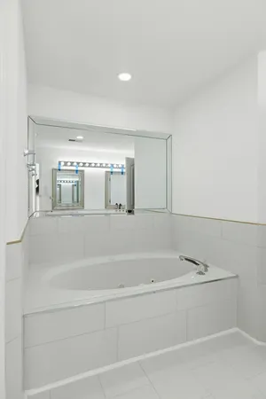 a bathroom with a bathtub and shower