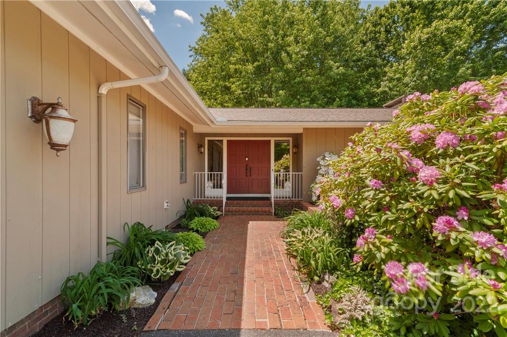 1674 Camp Branch Road Waynesville, NC 28786 - Photo 8 of 48 a front view of house and flowers