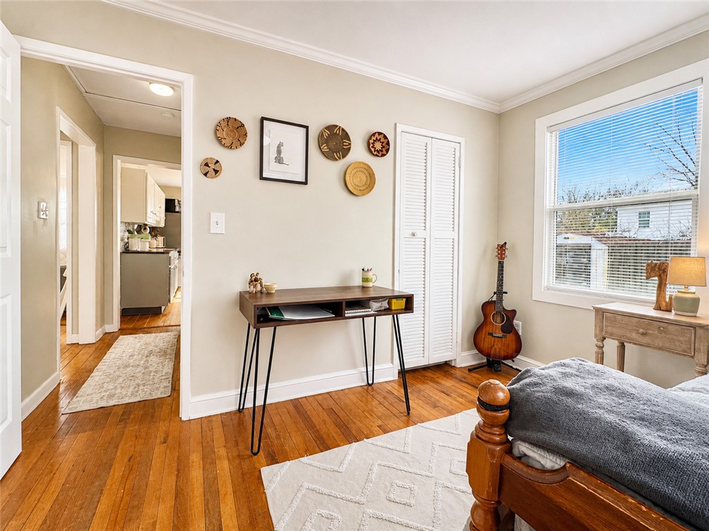 1909 Northview Avenue Anderson, SC 29625 - Photo 11 of 21 This cozy bedroom features warm hardwood floors and ample natural light, creating a comfortable living space.