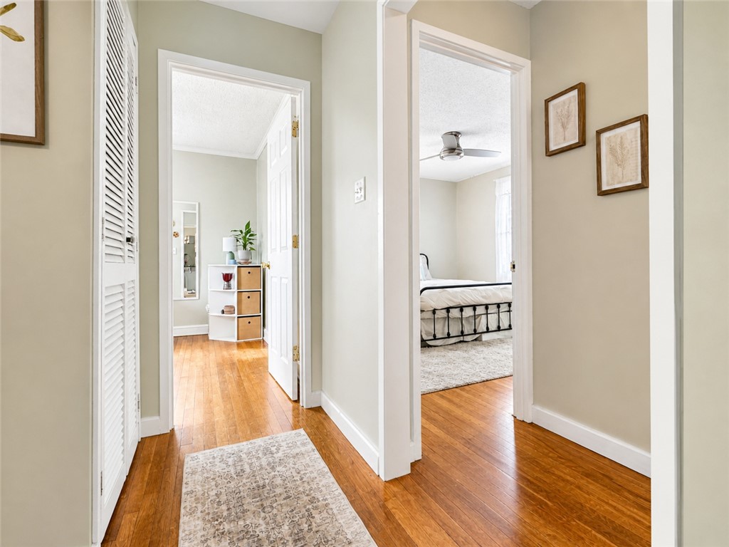 1909 Northview Avenue Anderson, SC 29625 - Photo 12 of 21 This interior hallway features warm hardwood flooring, connecting seamlessly to other rooms.