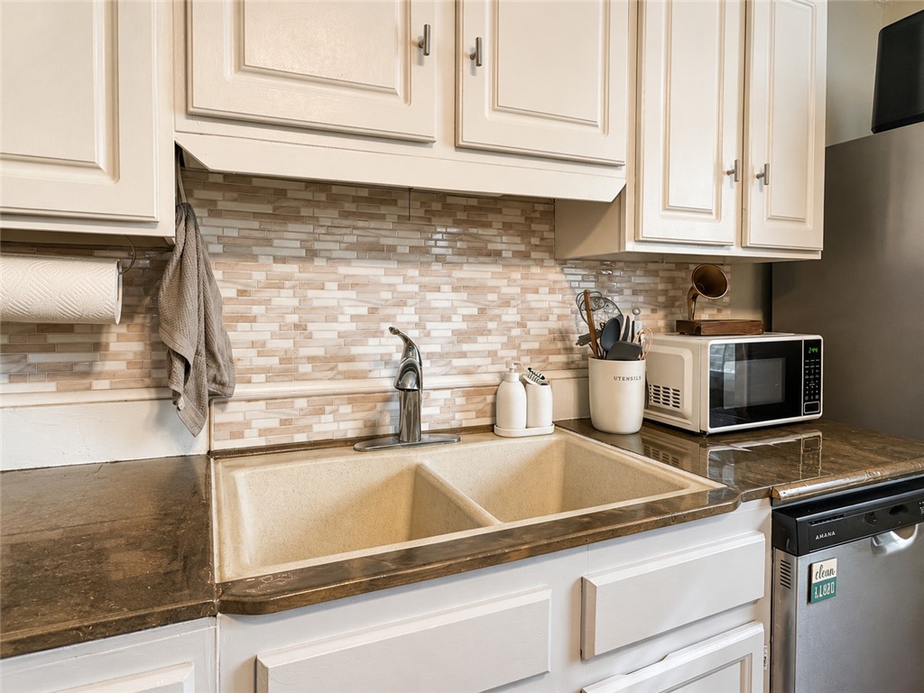 1909 Northview Avenue Anderson, SC 29625 - Photo 16 of 21 This kitchen features sleek cabinetry and modern appliances, creating a functional and inviting culinary space.