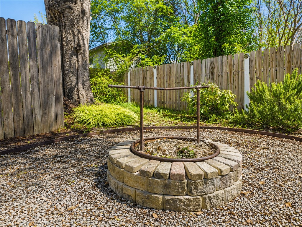 1909 Northview Avenue Anderson, SC 29625 - Photo 18 of 21 Enjoy the outdoor space with this well-maintained fence and charming stone fire pit.
