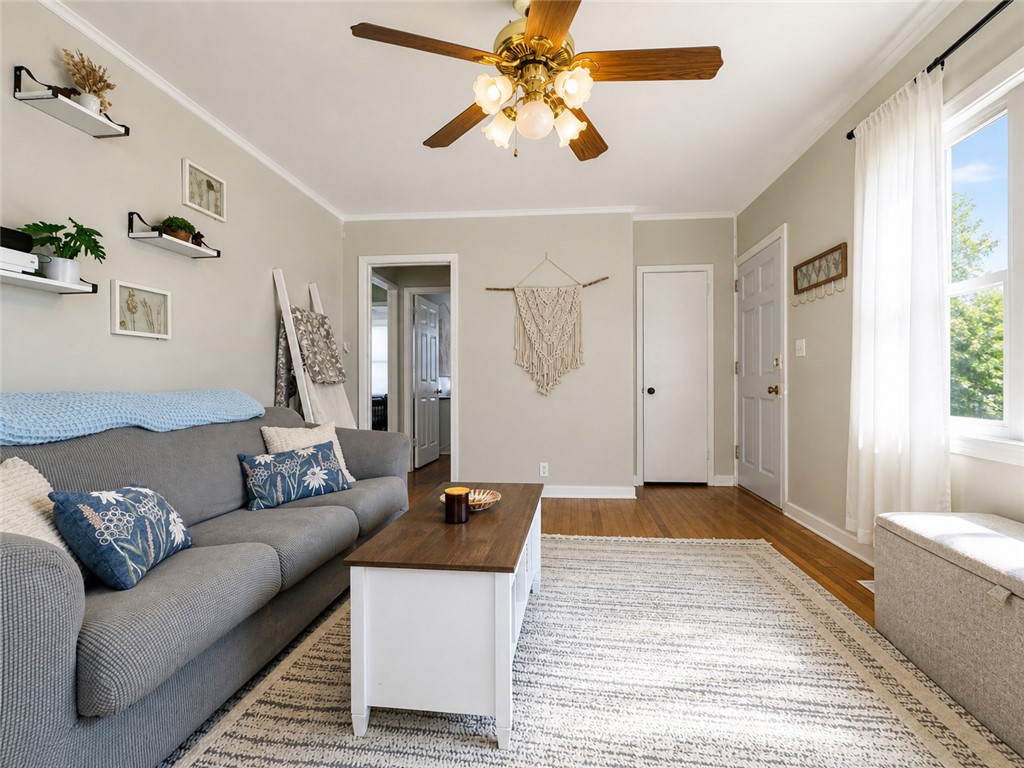 1909 Northview Avenue Anderson, SC 29625 - Photo 5 of 21 This bright and inviting living room features gleaming hardwood floors and crown molding.