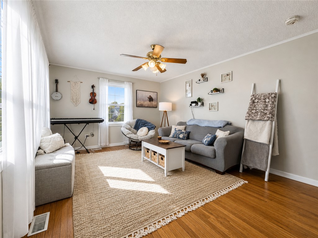 1909 Northview Avenue Anderson, SC 29625 - Photo 6 of 21 This inviting living area features warm wood flooring and abundant natural light.