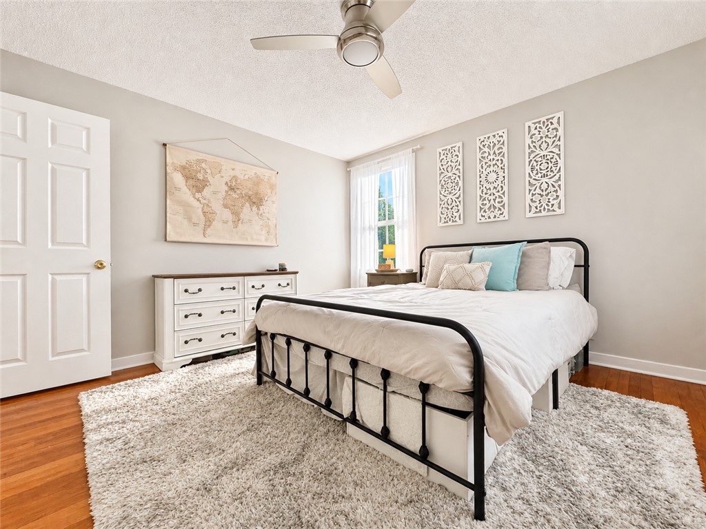 1909 Northview Avenue Anderson, SC 29625 - Photo 9 of 21 This inviting bedroom provides a comfortable retreat with a bright window and rich wood flooring.