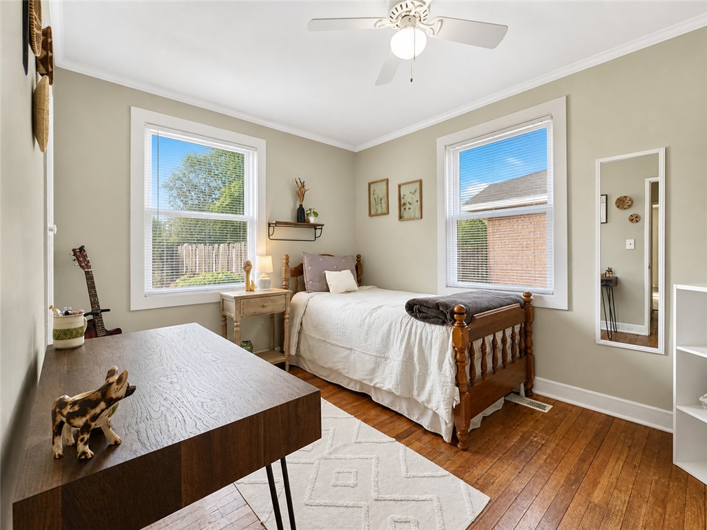 1909 Northview Avenue Anderson, SC 29625 - Photo 10 of 21 This cozy bedroom features warm hardwood floors and abundant natural light, creating a serene personal retreat.
