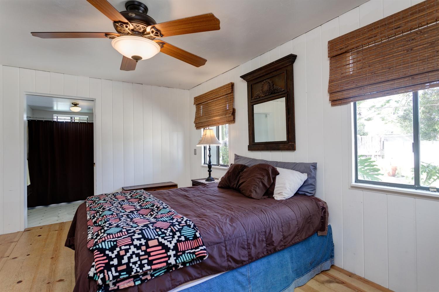 195 Grapevine Road Oak View, CA 93022 - Photo 13 of 41 a bedroom with a large bed and a window