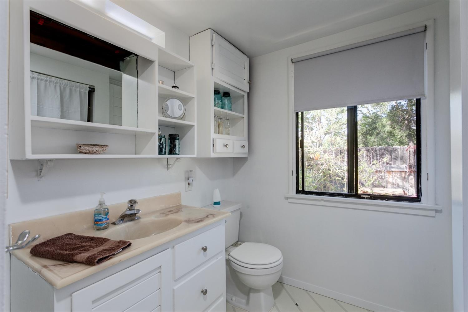 195 Grapevine Road Oak View, CA 93022 - Photo 14 of 41 a bathroom with a toilet a sink and mirror