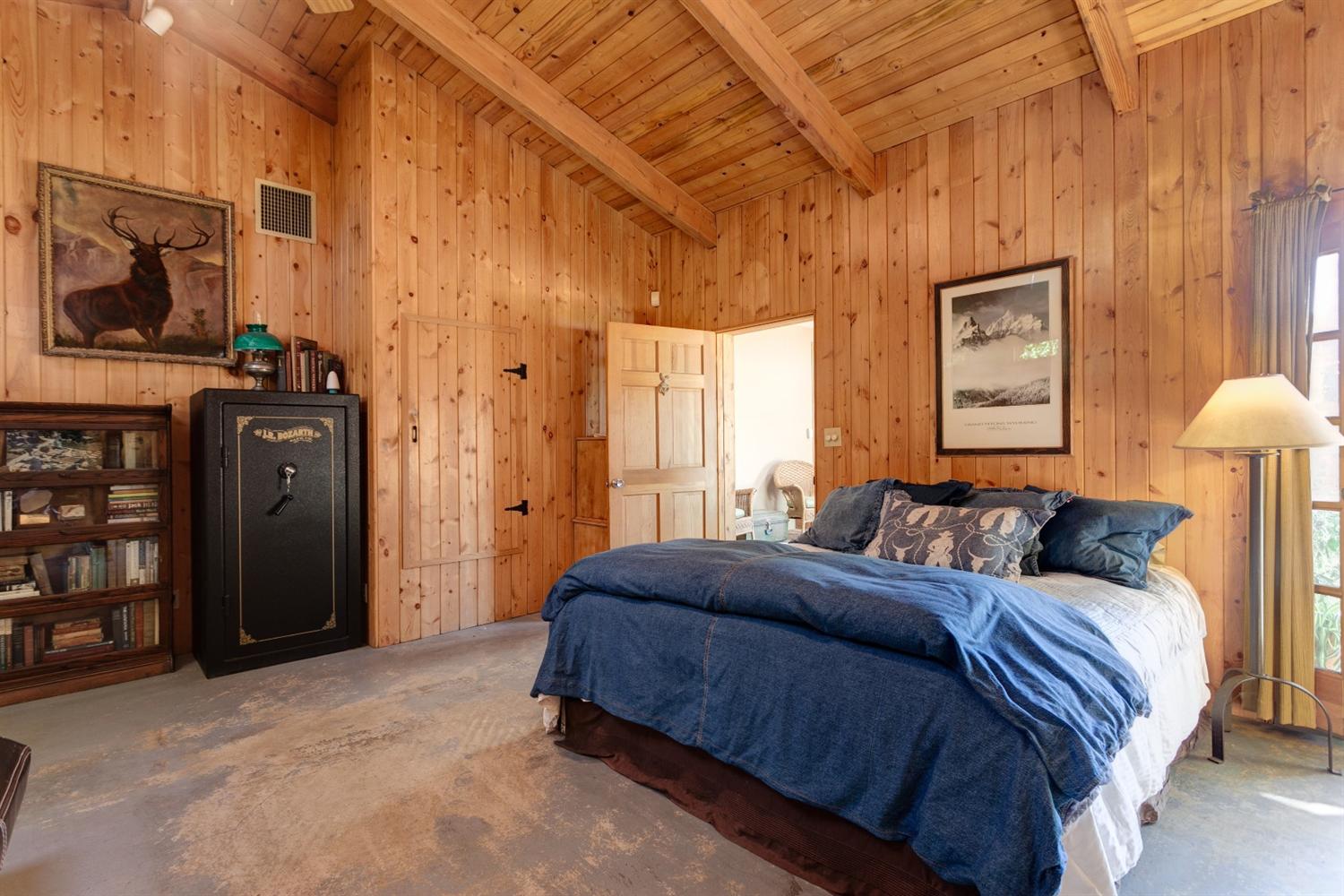 195 Grapevine Road Oak View, CA 93022 - Photo 21 of 41 a bedroom with a bed flat screen tv and a window