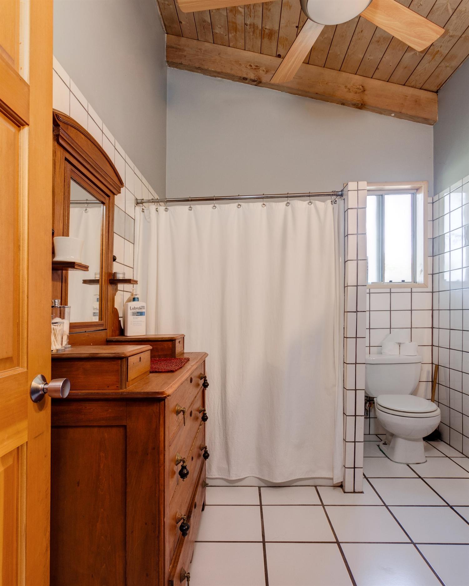 195 Grapevine Road Oak View, CA 93022 - Photo 25 of 41 a bathroom with a granite countertop sink and a toilet