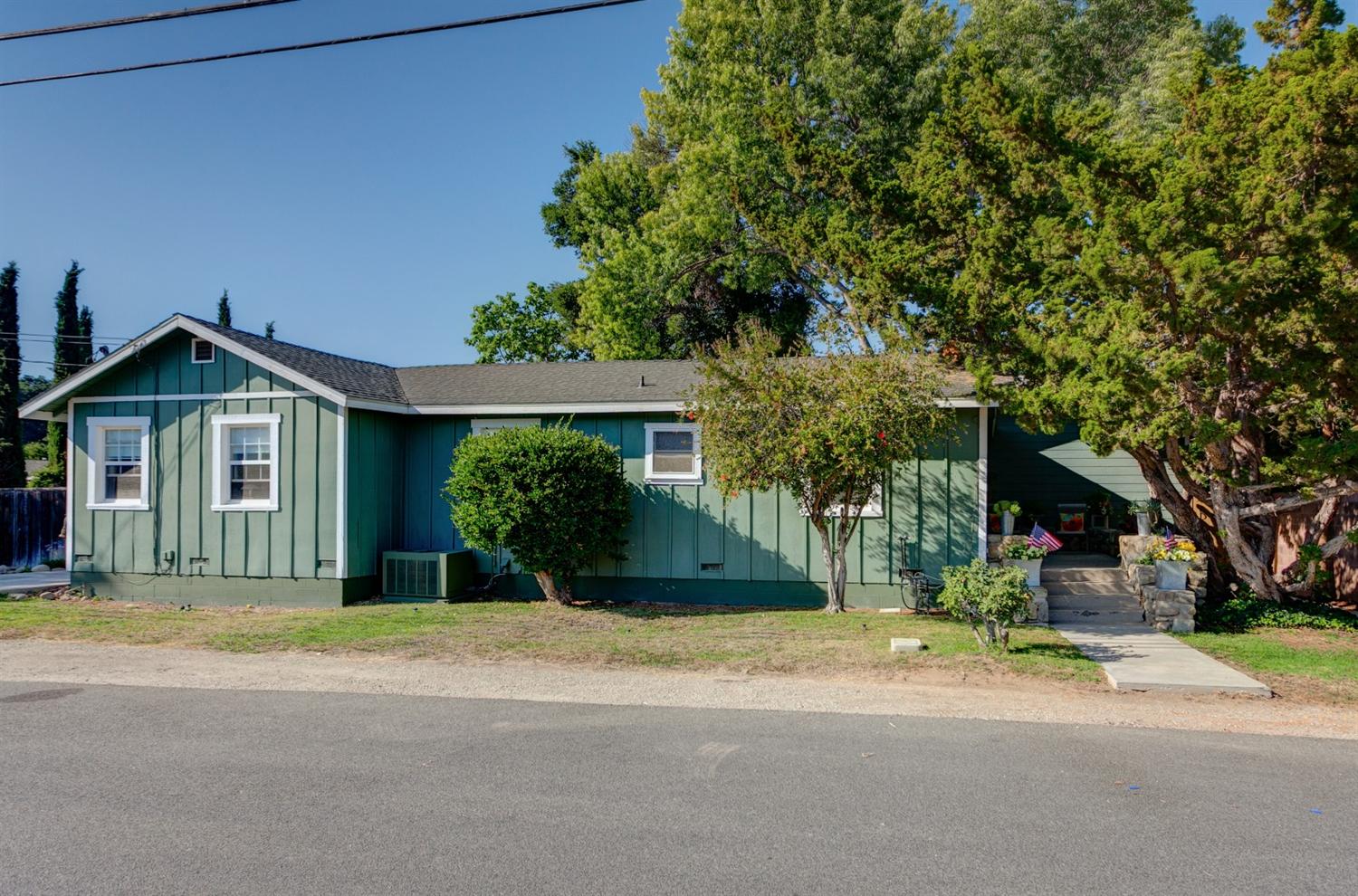 195 Grapevine Road Oak View, CA 93022 - Photo 28 of 41 a front view of a house with a yard and garage