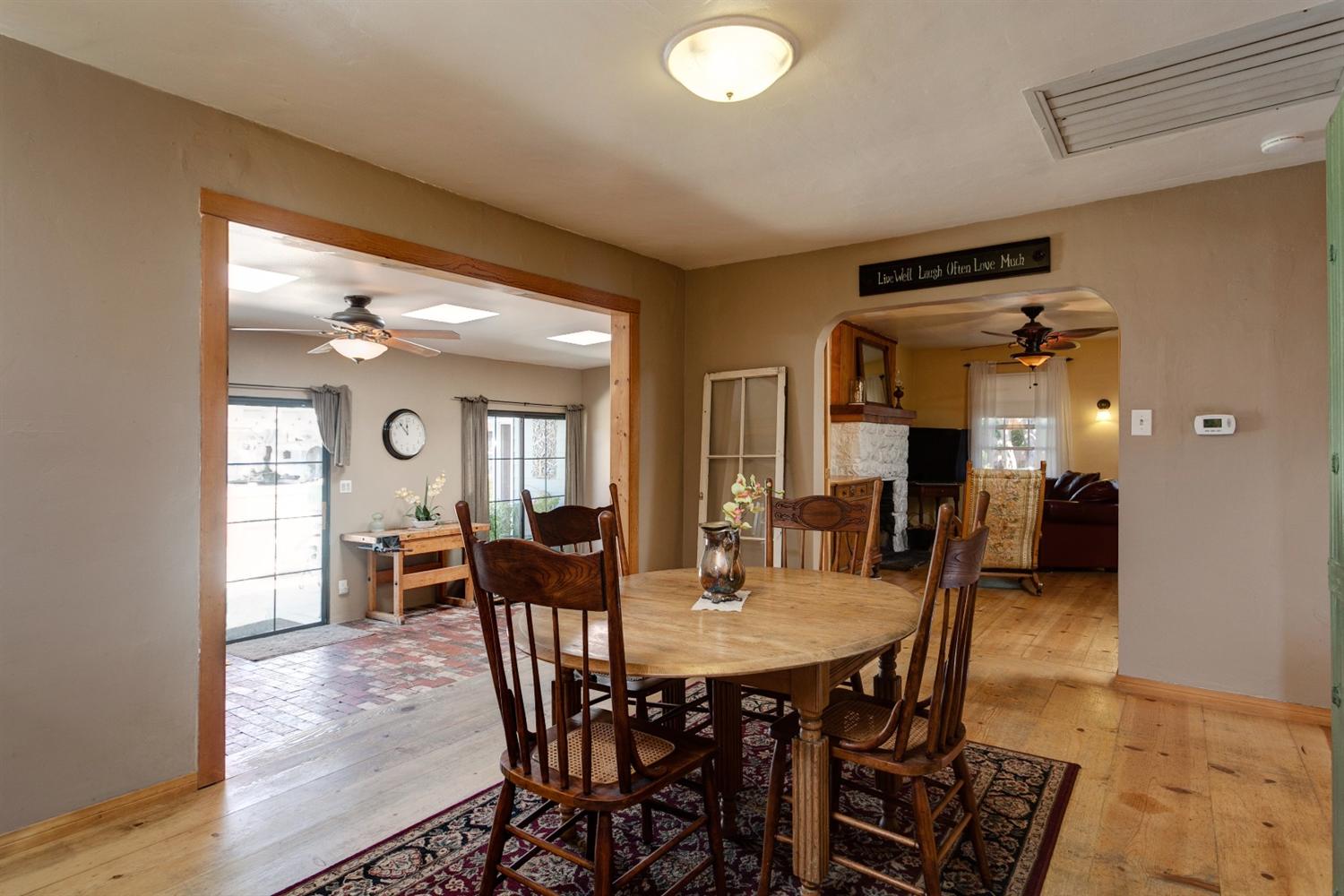 195 Grapevine Road Oak View, CA 93022 - Photo 7 of 41 a view of a dining room with furniture and wooden floor