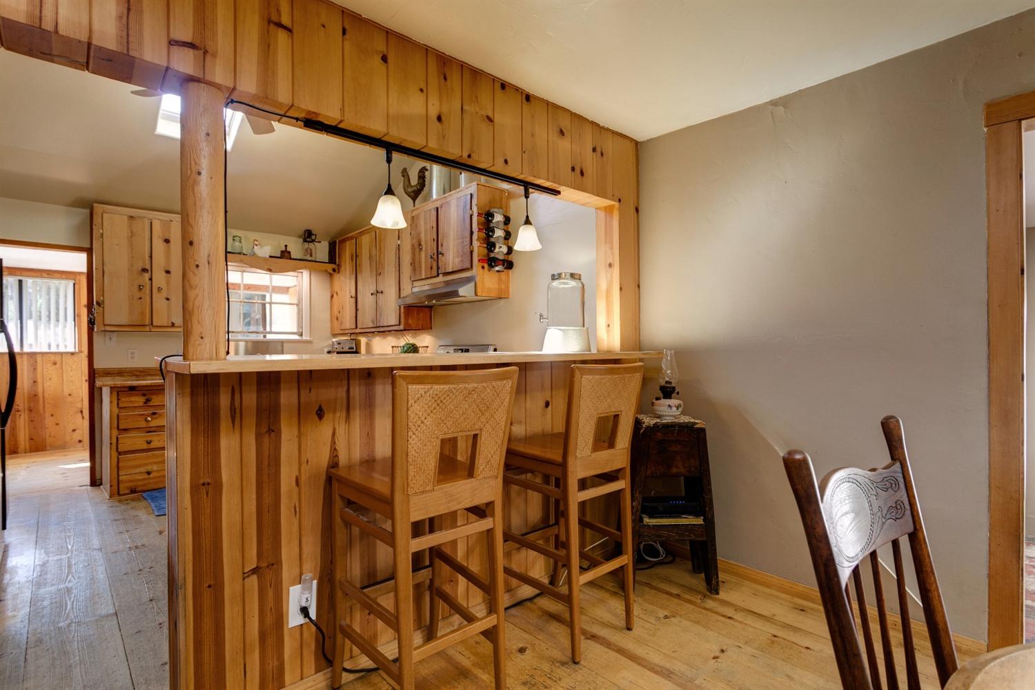 195 Grapevine Road Oak View, CA 93022 - Photo 8 of 41 a dining room with furniture and wooden floor