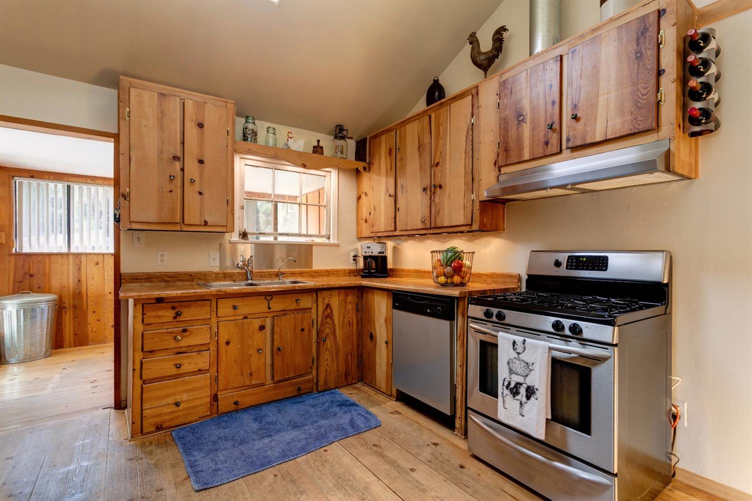 195 Grapevine Road Oak View, CA 93022 - Photo 9 of 41 a kitchen with stainless steel appliances granite countertop a stove and a sink