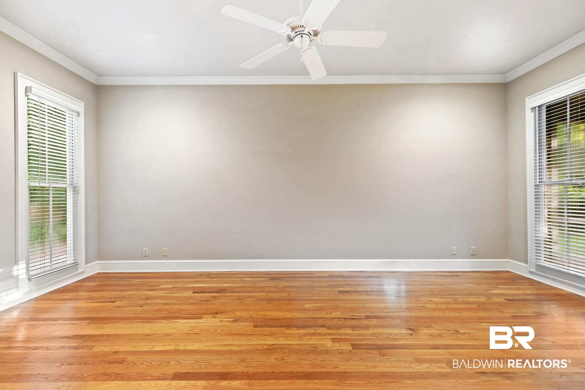 202 Beall Lane Daphne, AL 36526 - Photo 21 of 46 Empty room featuring light hardwood / wood-style floors, ceiling fan, and plenty of natural light