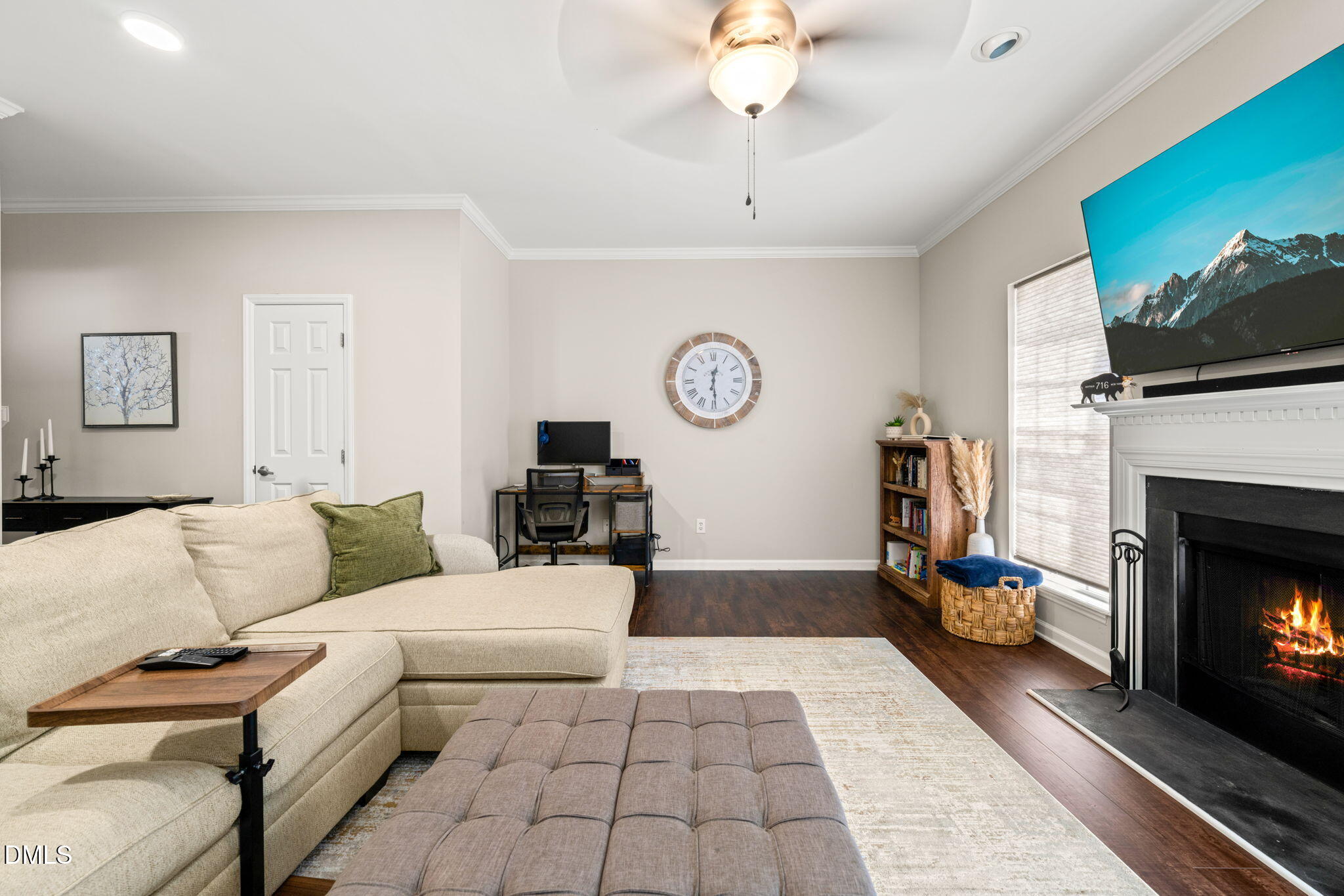 4323 Pine Springs Court Raleigh, NC 27613 - Photo 13 of 38 a living room with furniture and a fireplace