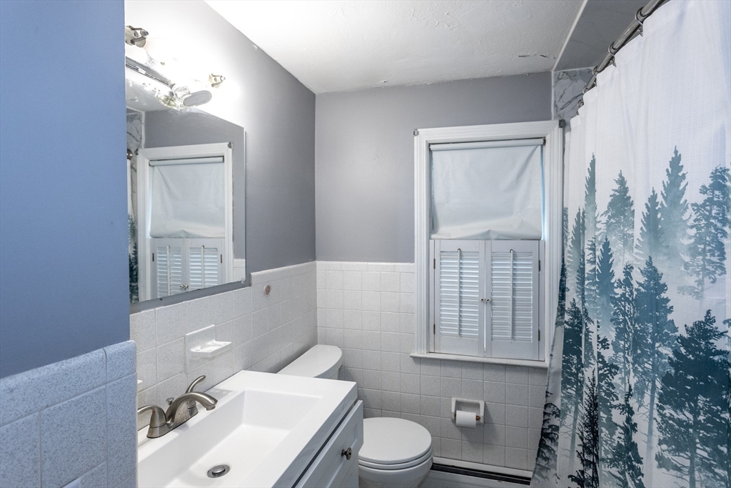 67 Donbray Road Springfield, MA 01119 - Photo 12 of 36 a bathroom with a sink a toilet and tub