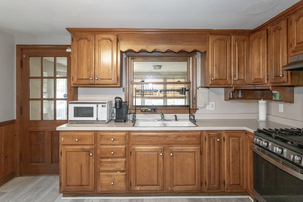 67 Donbray Road Springfield, MA 01119 - Photo 7 of 36 a kitchen with cabinets and appliances