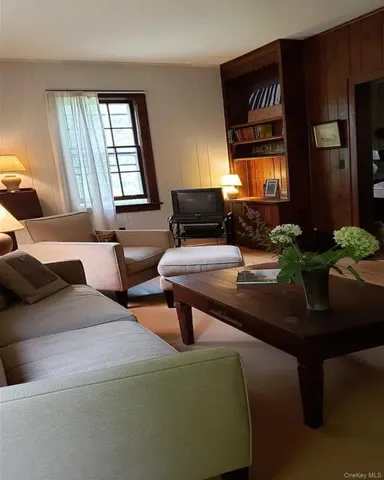 a view of a livingroom with furniture and a fireplace