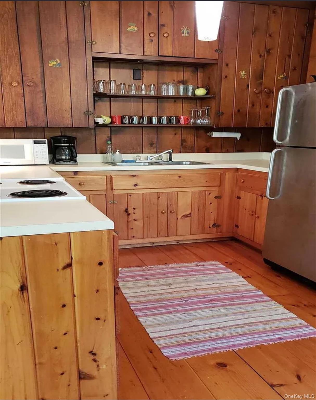 717 Spring Lake Road Red Hook, NY 12571 - Photo 5 of 19 a kitchen with stainless steel appliances a stove and a refrigerator