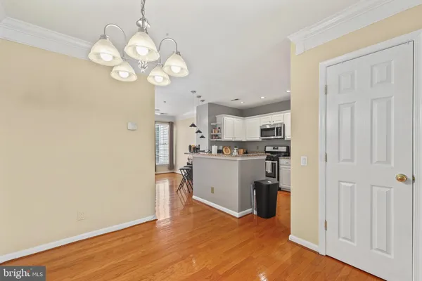 a view of a kitchen with wooden floor