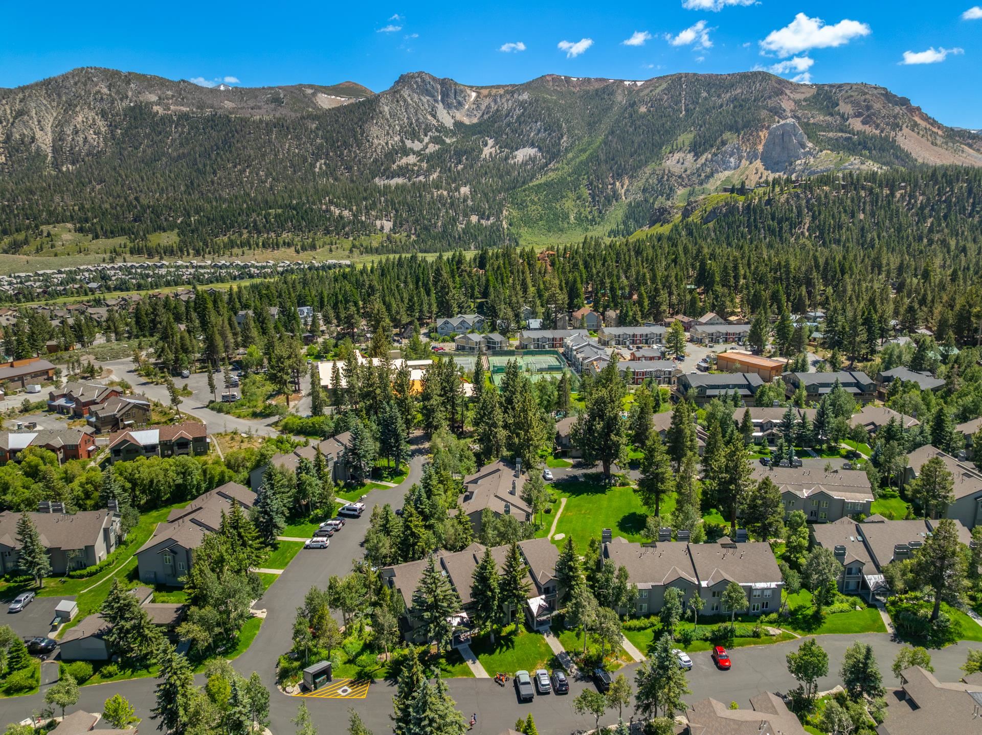 609 Golden Creek Road, Unit 609 Mammoth Lakes, CA 93546 - Photo 37 of 42 Expansive aerial perspective showcasing a mountain community with dense evergreen forests