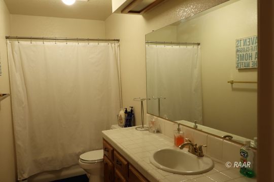 824 Walker Lane Ridgecrest, CA 93555 - Photo 16 of 20 a bathroom with a sink toilet and shower