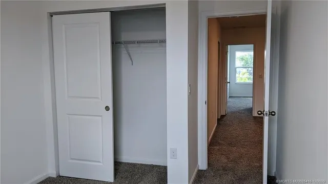 a sign board with palm trees